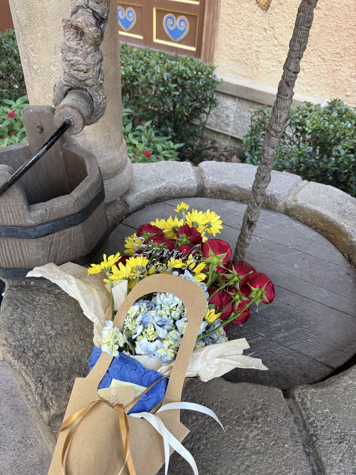 The Fairest One bouquet on the wishing well at EPCOT's Germany pavilion, seen from a closer angle